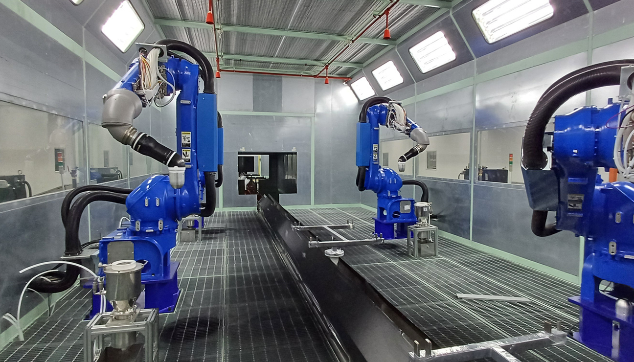 JRI robotic paint booth with blue industrial spray robots