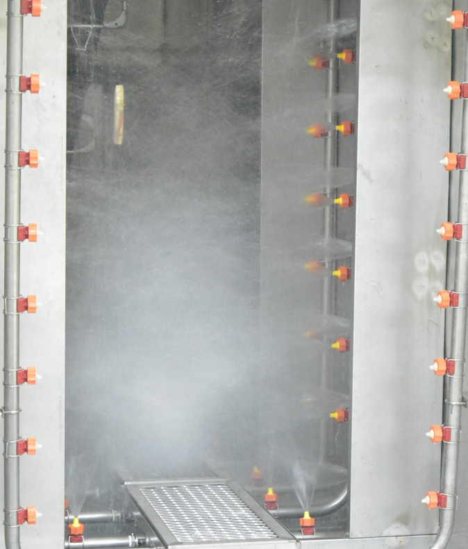 Spray pretreatment nozzles in operation